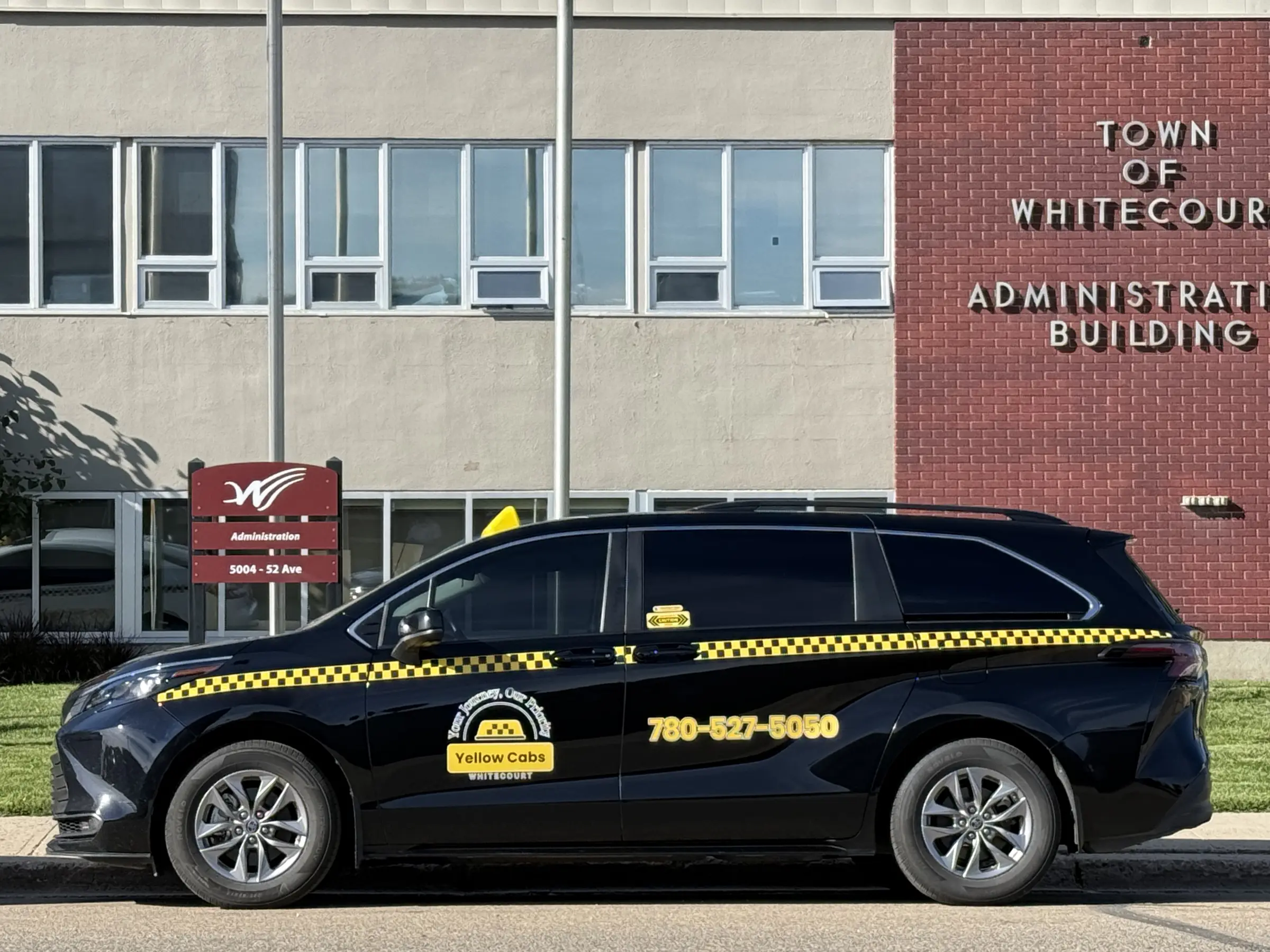 Yellow Cabs Whitecourt taxi outside the Town of Whitecourt Administration Building