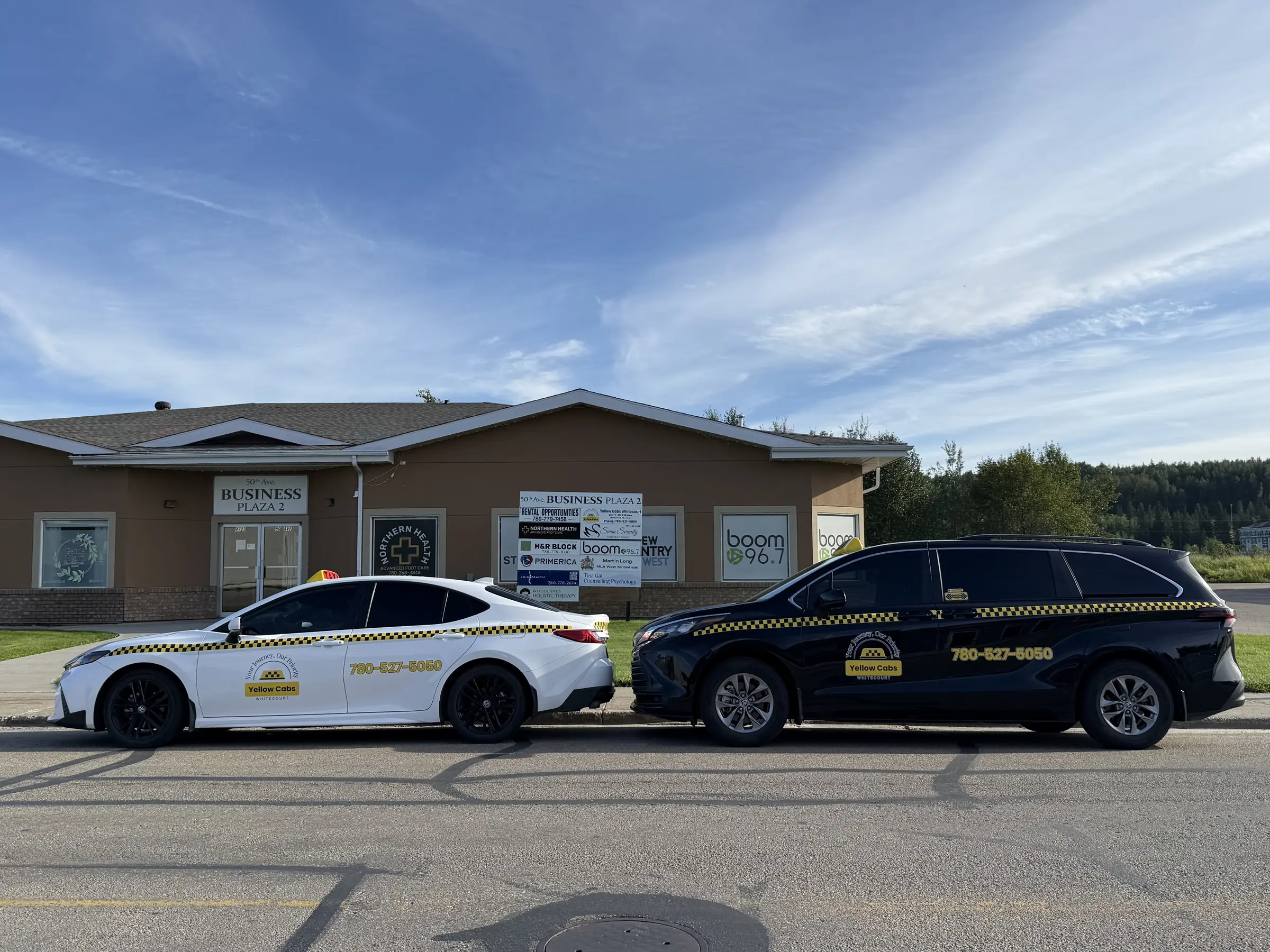 Yellow Cabs Whitecourt taxi with door open, ready for a passenger